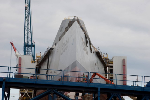 The Zumwalt bow-on at Bath Iron Works. DDG-1001, the USS Michael Monsoor, sits behind her, more than 60 percent complete.