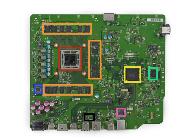 The system's motherboard. The CPU/GPU is outlined in red, and the RAM is highlighted in orange. The green square outlines the system's 8GB of eMMC NAND, which is used for caching.