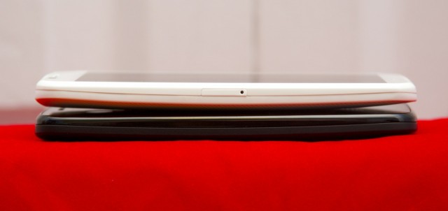 Perhaps due to the removable cover, the Moto G (bottom) is a little thicker and heavier than the Moto X.