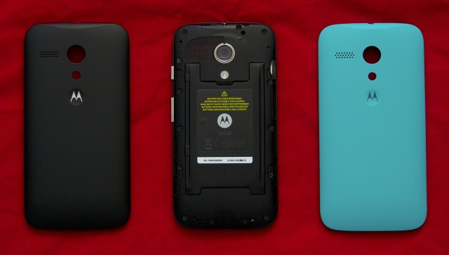 The Moto G's back cover pops off and can be replaced with one of six colorful shells. The default black cover is shown to the left.