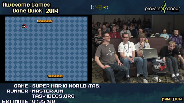 The Awesome Games Done Quick crowd reacts with glee as the <i>Super Mario World</i> "total control" exploit is demonstrated live for the first time at AGDQ 2014, the kind of moment that's best experienced live.
