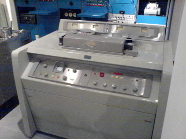 The AMPEX Quadruplex VR-1000-A was the first commercially produced video tape recorder when it was released in 1961. It used 2-inch reel-to-reel tape.