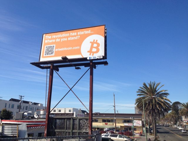 This billboard, mounted on 12th Street at 8th Avenue in East Oakland, towers above a Vietnamese phở restaurant.