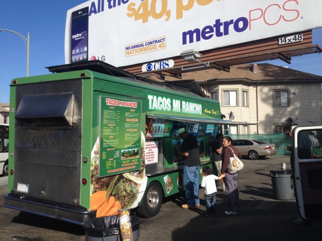 This taco truck sits within about 20 feet of an Arisebitcoin billboard in Oakland at the intersection of International Boulevard and 1st Avenue.