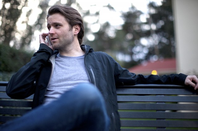 Kyle Kirchhoff, CEO of Leap Transit, sitting on a bench in the Presidio, San Francisco.