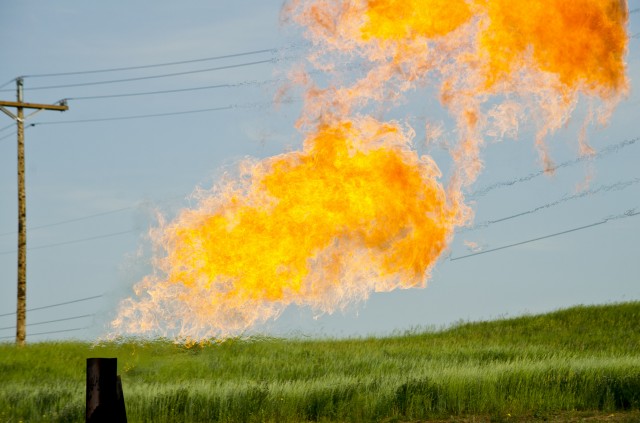 Natural gas being flared near a production well in North Dakota.