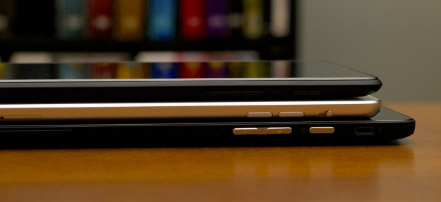 The Venue 8 Pro (bottom) is a little thicker than either the iPad or the Nexus 7. The micro USB charging port is just above the power button.