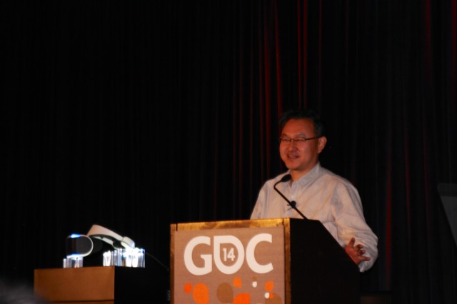 Yoshida speaks next to the just-unveiled Project Morpheus developer prototype.