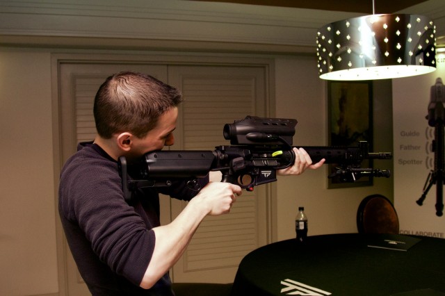 Ars Android expert Ron Amadeo hefts a TrackingPoint AR-15 prototype at the 2014 CES back in January.