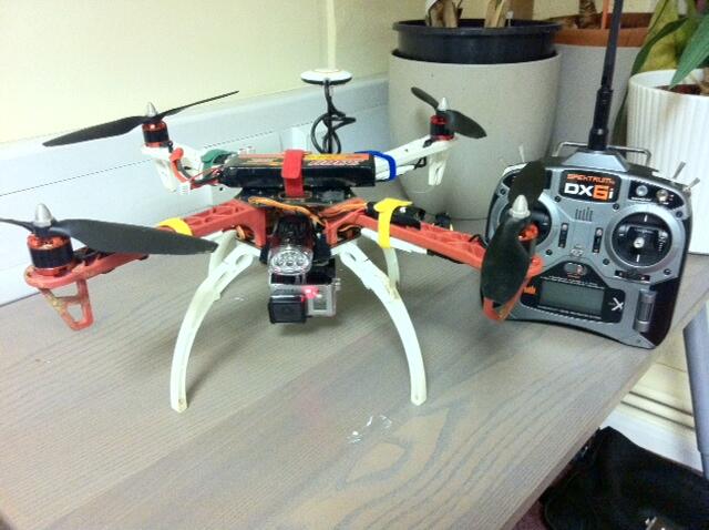 A DJI F450 quadcopter with an onboard GoPro and a Spektrum DX6i remote control unit.