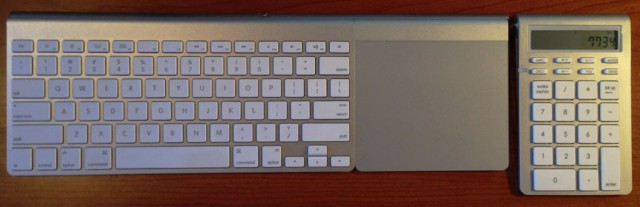 The Satechi Wireless Smart Keypad on my desk next to my keyboard and trackpad.