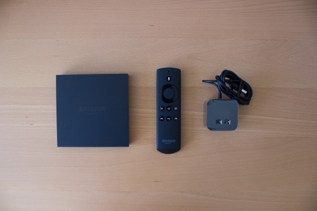 From left, the Fire TV box, the remote, and the power cable that come in the box. 