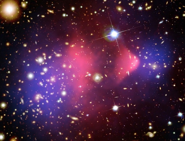 Composite image of X-ray (pink) and weak gravitational lensing (blue) of the famous Bullet Cluster of galaxies.
