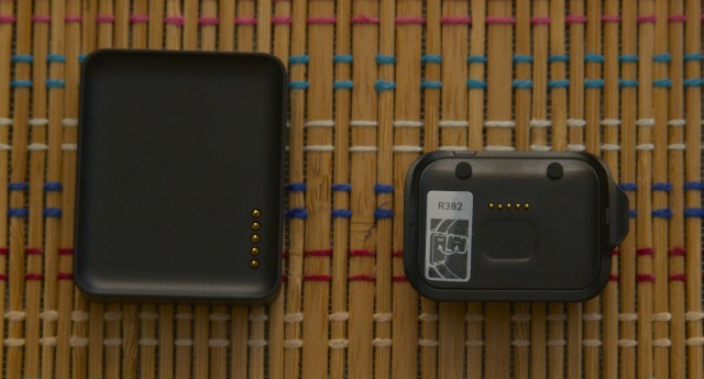 The G Watch charging cradle (left) and the Gear Live's smaller cradle (right).