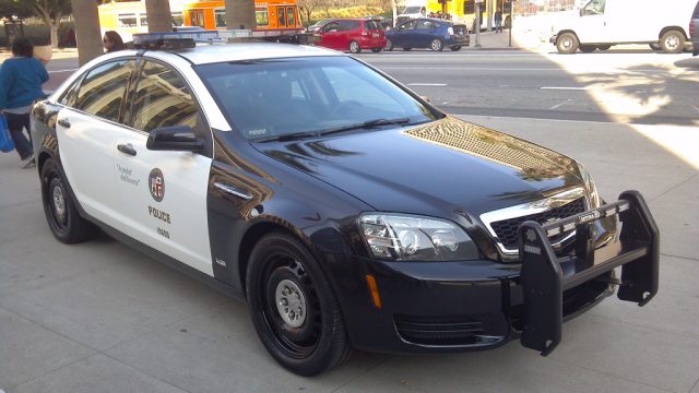 This LAPD patrol car is equipped with a LPR unit, mounted just in front of the light bar on the roof of the vehicle.