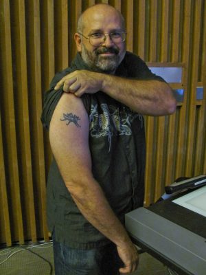 Lycos founder Michael Mauldin shows off his spider tattoo, featuring the seven numbers of his 1997 patent for "skimming" digital audio and video files. Mauldin's patent was not one of the patents used in the lawsuit against Google. 