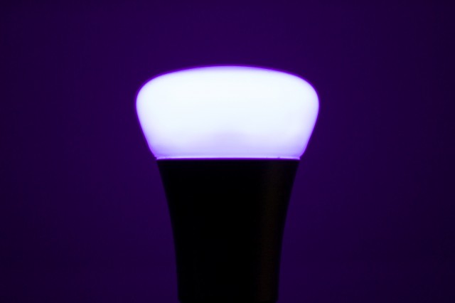 A Philips Hue bulb, strutting its purple stuff.