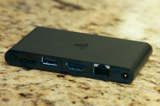A rear view of the PSTV's ports. Left to right: power button, Vita memory card slot, USB, HDMI, Ethernet, power.