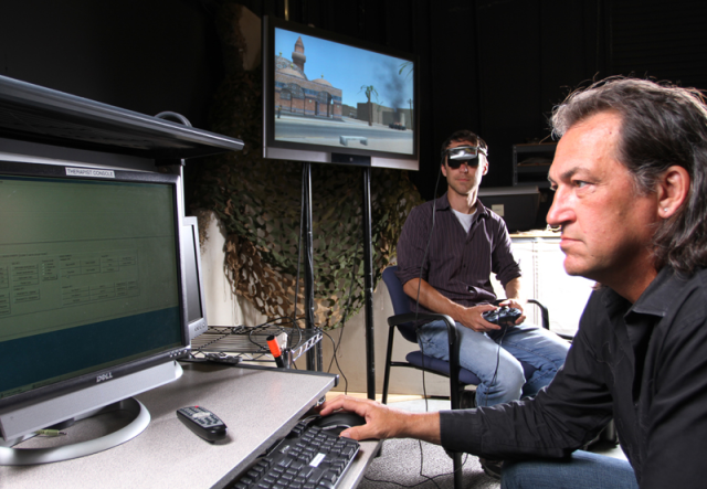 Dr. Skip Rizzo (right) monitors a patient as he use PTSD virtual reality immersion program Bravemind.