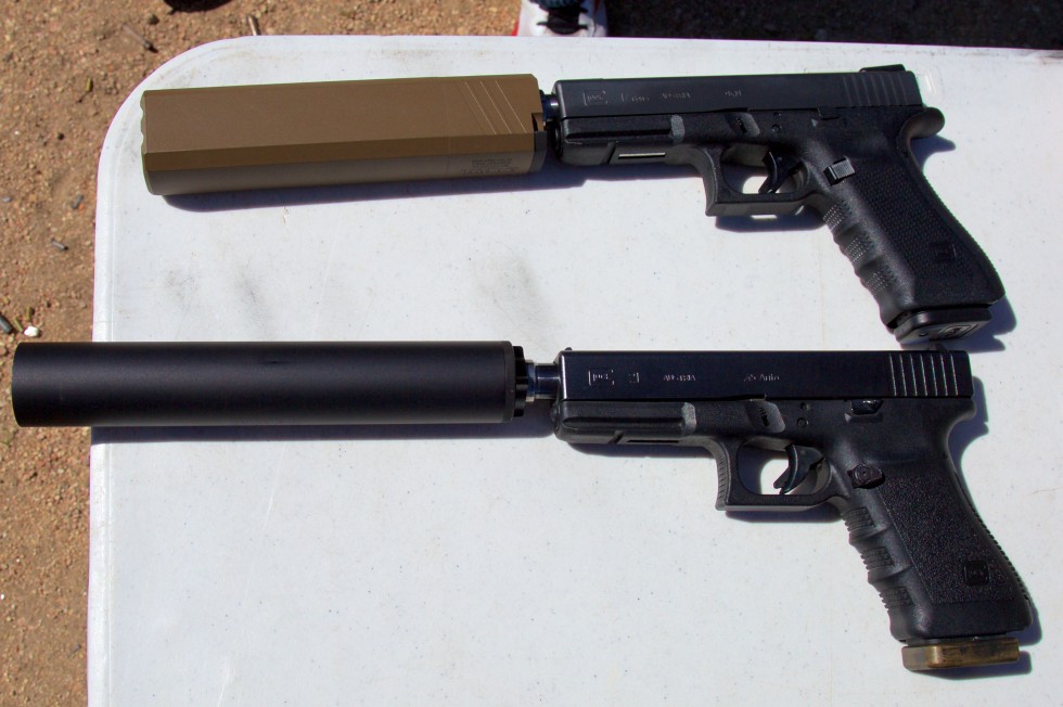 The eccentric Osprey suppressor, top, versus the more traditionally round Octane, bottom. The Osprey's shape keeps it out of the way of the pistol's sights.