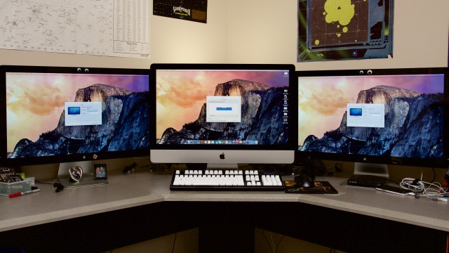 The Retina iMac on my desk, driving my pair of 27-inch Thunderbolt monitors.