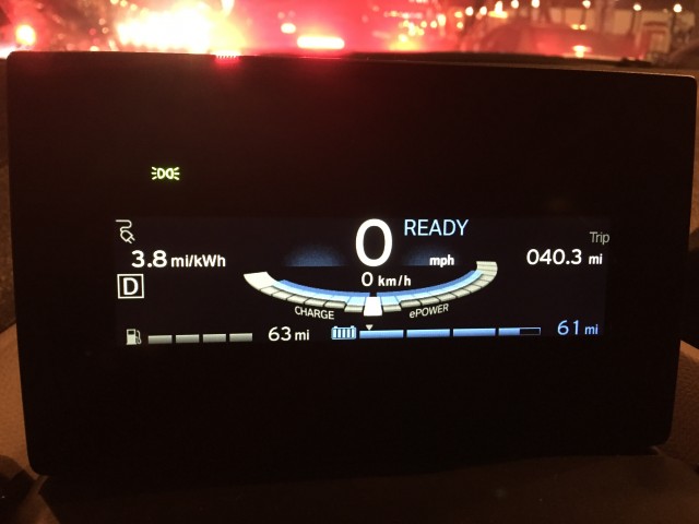 The i3's main display. The semicircle underneath the speed reading tells you if you're using energy (right side) or harvesting it (left side). 