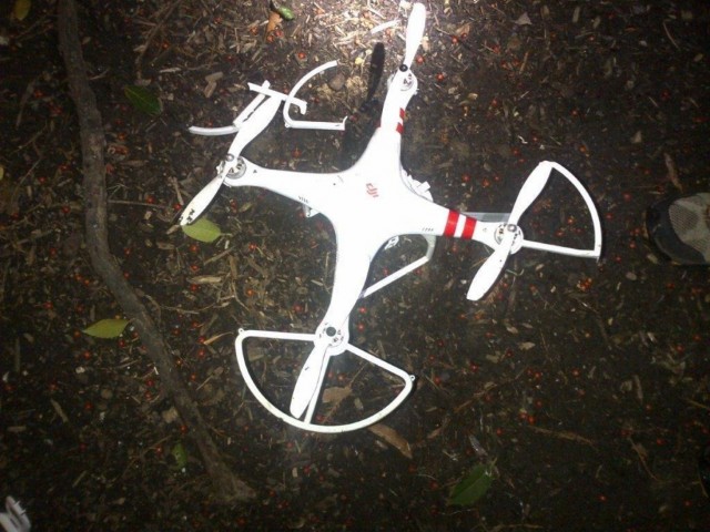 The downed drone on the White House grounds, with broken propeller guards, appears to have hit a tree.