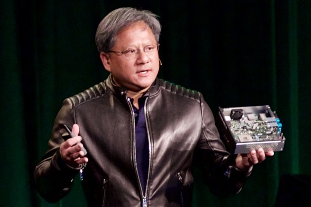Jen-Hsun Huang with the Nvidia Drive CX.
