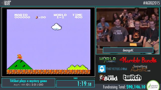 Members of the TASBot team smile as <i>Super Mario Bros.</i> runs through <i>Super Mario World</i> during AGDQ Sunday night.