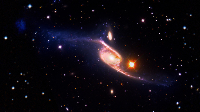A spiral galaxy with an associated dwarf galaxy (the dim blue smudge in the far upper-left).