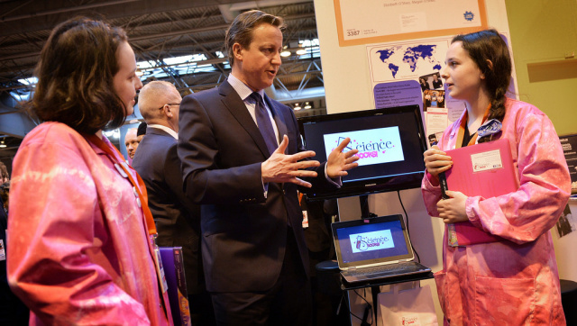 Current UK Prime Minister David Cameron stands near the word "Science" at the Big Bang Fair.