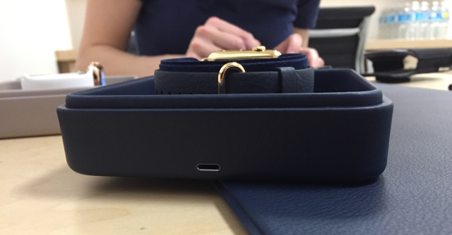 You use a Lightning port on the back of the case to plug the watch in.