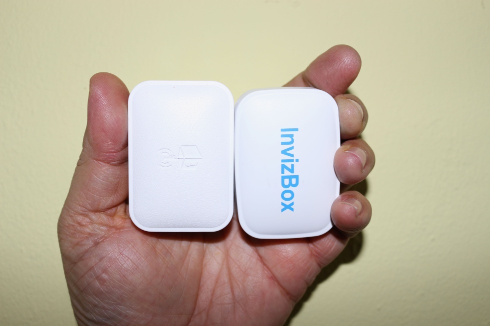 Hands on (literally): the two Tor "travel router" contenders, Anonabox (left) and InvizBox (right), are ready to conceal your Internet wanderings.