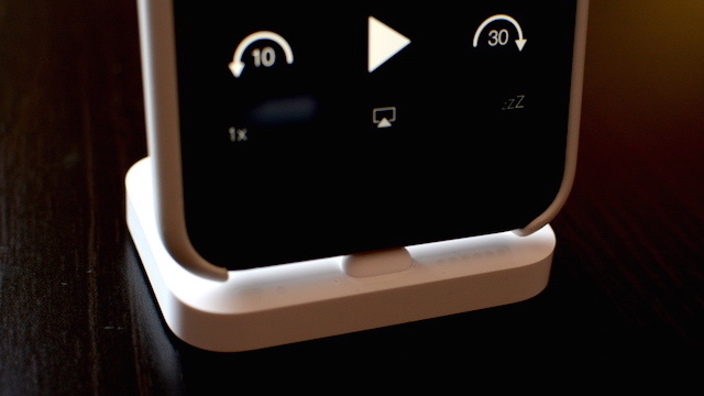 An iPhone 6 in a case, resting comfortably in Apple's new Lightning Dock.