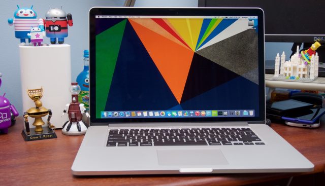 Laptop computer sitting on desk.