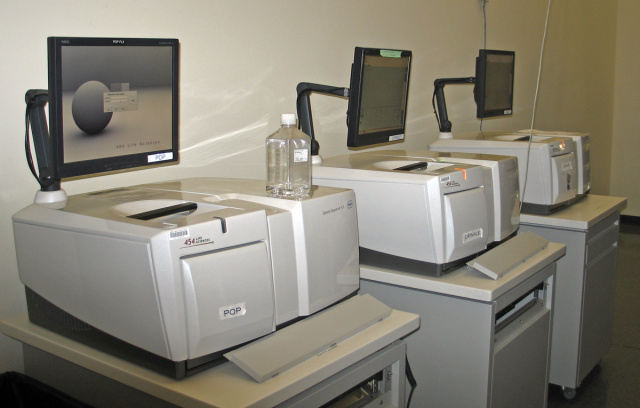 A small row of identical sequencing machines (454's from a company now owned by Roche) at the Broad Institute.