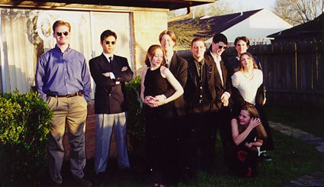 The local Babbage's crew (or most of them, anyway) circa 1997, when Windows 95 was in full effect. Also in full effect: <em>Mall Rats</em>-style haircuts. Author's one-day wife and author himself are third and fourth from left, respectively.