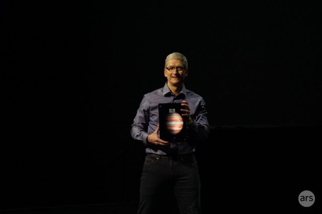 Tim Cook stands with the new iPad Pro.