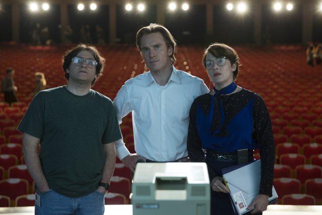 Left to right: Michael Stuhlbarg as Andy Hertzfeld, Michael Fassbender as Steve Jobs, and Kate Winslet as Joanna Hoffman in <em>Steve Jobs</em>.