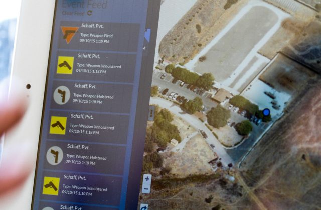 Jim Schaff of Yardarm demonstrates the readings that pop up when a gun is holstered, unholstered, and fired at a shooting range in San Jose, California, on Thursday, September 10, 2015.  The sensor can alert dispatchers when an officer pulls his or her weapon and when shots have been fired, and transmit the location back to dispatch.