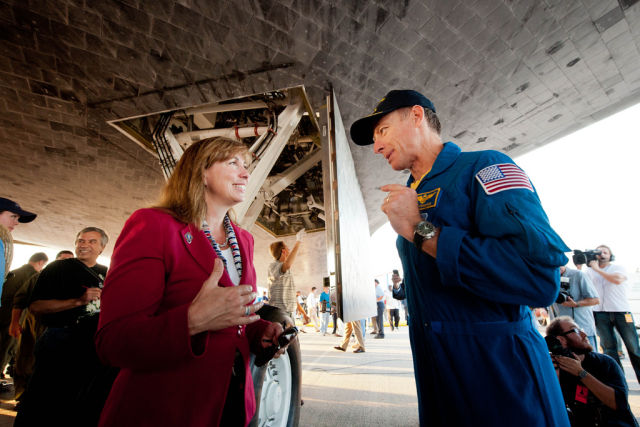 Garver and Commander Chris Ferguson talk underneath the space shuttle Atlantis shortly after the final shuttle mission landed in 2011.
