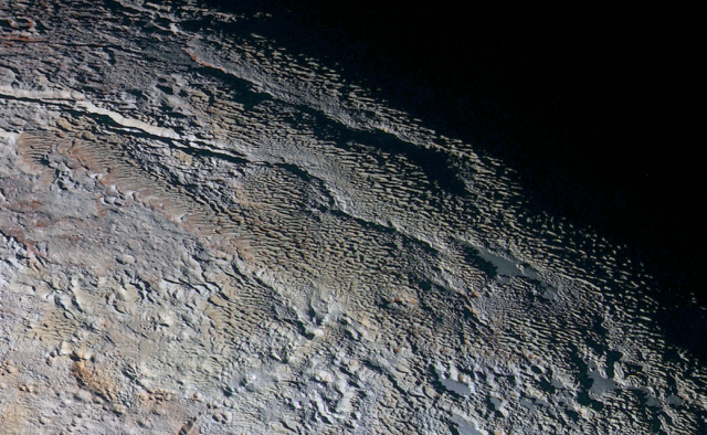 Why, for goodness' sake, do some parts of Pluto look like snake skin?