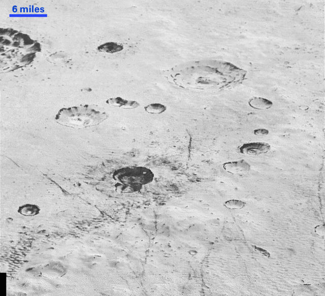 Pluto's icy plains and layered craters may be the key to unlocking its curious history.