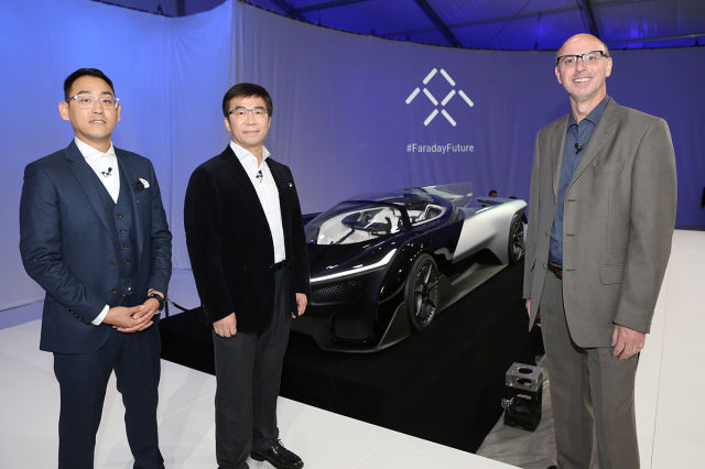 Richard Kim, Faraday Future global design director, left, poses for a photo with Ding Lei, co-founder, global vice chairman, managing director, SEE Pland, Letv, second left, and Nick Sampson, VP of R&D and Engineering at  FFZERO1 pre-CES reveal event in Las Vegas on Monday, January 4, 2016. (Bizuayehu Tesfaye/ AP Images for Faraday Future)