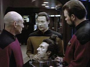 Data, with the severed, long-buried head of his "future" self. 