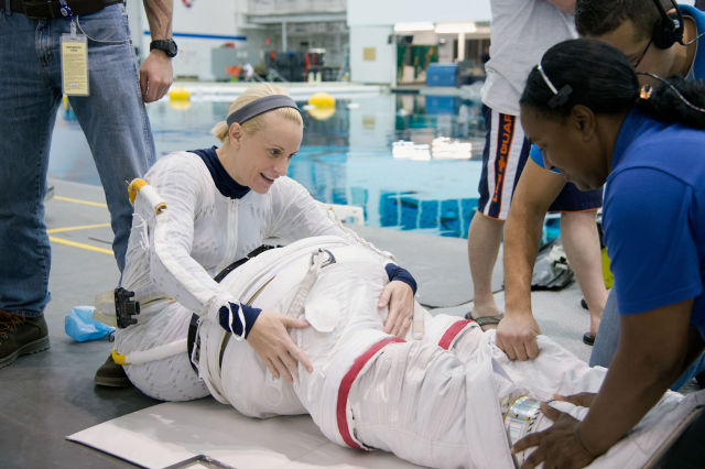 Kate Rubins undergoes spacewalk training at NASA's Neutral Buoyancy Laboratory.