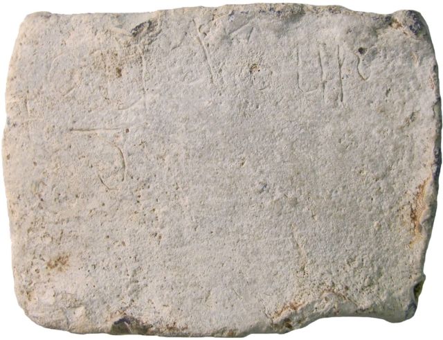 This lead tablet is inscribed with the word "Cudberg," an Anglo-Saxon woman's name.