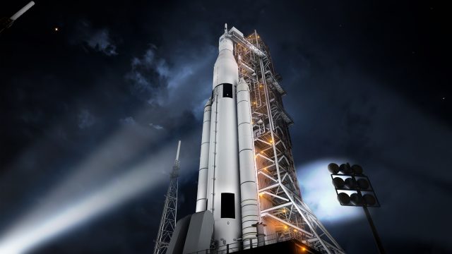 Spotlights shine on the largest rocket ever built.