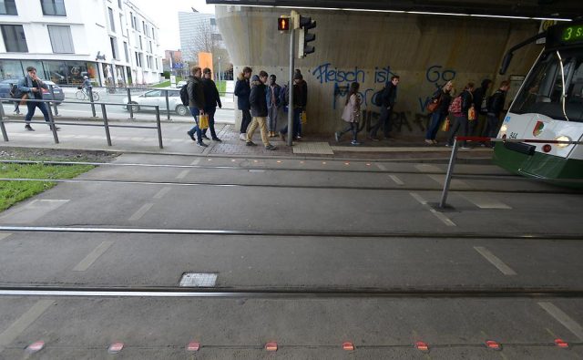 German city embeds LED red lights into sidewalks for smartphone addicts