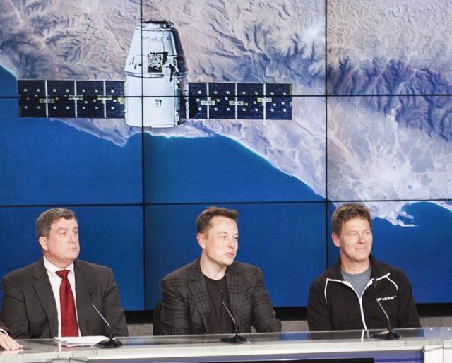 NASA's Kirk Shireman, left, was content to watch as Elon Musk handled all the questions after the dramatic Falcon 9 rocket landing.